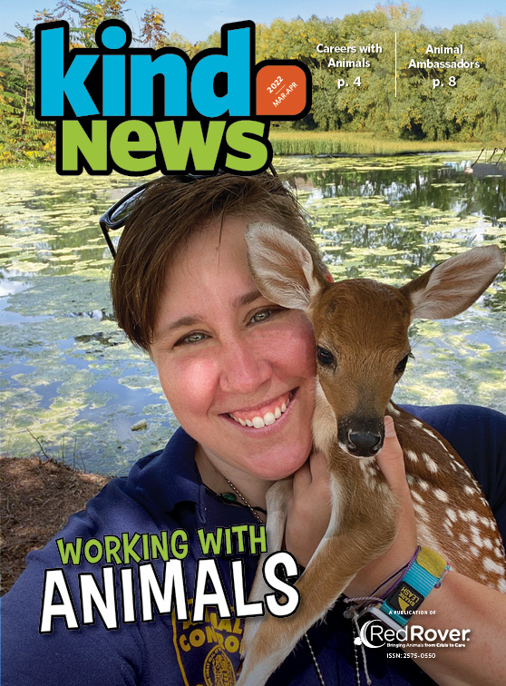 Kind News March/April 2022 Cover: white woman with short hair holding a baby deer