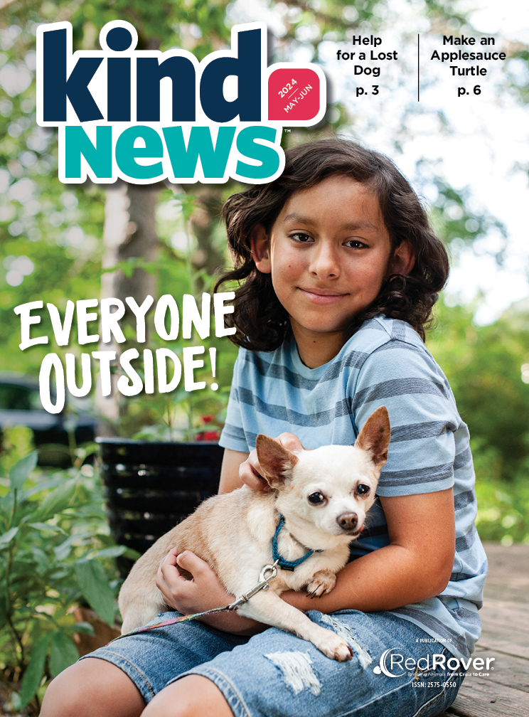 Magazine cover features child sitting outside. The child has dark brown hair wearing a blue striped shirt. The child is holding a small, beige dog with pointy ears.